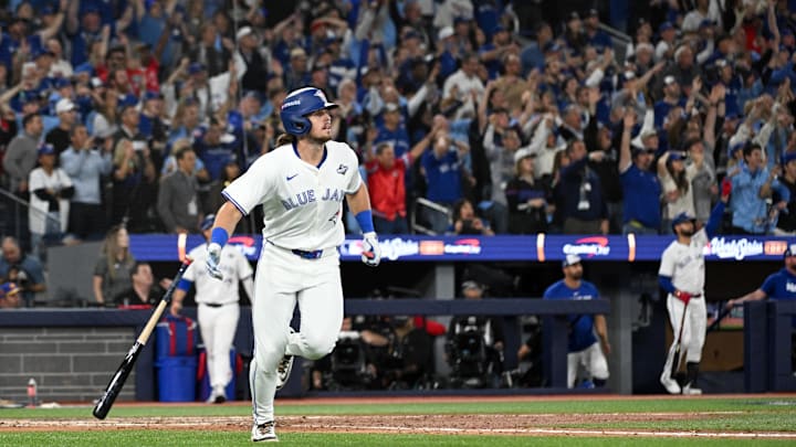Oct 24, 2025; Toronto, Ontario, CAN; Toronto Blue Jays right fielder Addison Barger (47) hits a grand slam against the Los Angeles Dodgers in the sixth inning during game one of the 2025 MLB World Series at Rogers Centre. Mandatory Credit: Dan Hamilton-Imagn Images