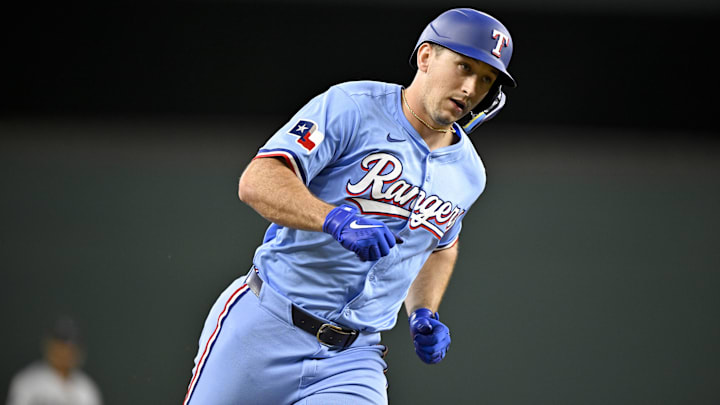 Texas Rangers left fielder Wyatt Langford rounds the bases after he hit a home run.