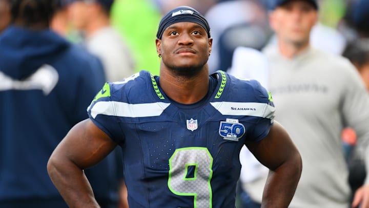 Sep 21, 2025; Seattle, Washington, USA; Seattle Seahawks running back Kenneth Walker III (9) looks on from the sideline during the second half against the New Orleans Saints at Lumen Field. 