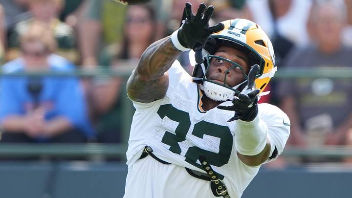 Green Bay Packers running back MarShawn Lloyd (32) catches a pass during the sixth day of training camp on Aug. 4, 2026, at Ray Nitschke Field in Ashwaubenon, Wis.