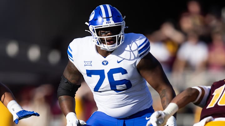 Nov 23, 2024; Tempe, Arizona, USA; Brigham Young Cougars offensive lineman Caleb Etienne (76) against the Arizona State Sun Devils at Mountain America Stadium. Mandatory Credit: Mark J. Rebilas-Imagn Images Nov 23, 2024; Tempe, Arizona, USA; Brigham Young Cougars offensive lineman Caleb Etienne (76) against the Arizona State Sun Devils at Mountain America Stadium. Mandatory Credit: Mark J. Rebilas-Imagn Images