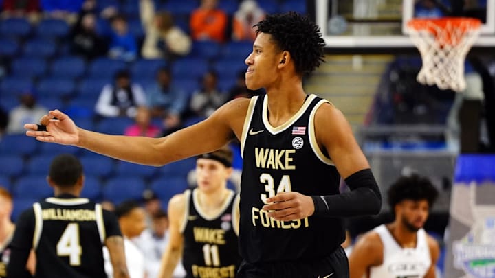 Mar 9, 2023; Greensboro, NC, USA; Wake Forest Demon Deacons forward Bobi Klintman (34) reacts to his three point shot against the Miami (Fl) Hurricanes during the first half of the quarterfinals of the ACC tournament at Greensboro Coliseum. Mandatory Credit: John David Mercer-Imagn Images Mar 9, 2023; Greensboro, NC, USA; Wake Forest Demon Deacons forward Bobi Klintman (34) reacts to his three point shot against the Miami (Fl) Hurricanes during the first half of the quarterfinals of the ACC tournament at Greensboro Coliseum. Mandatory Credit: John David Mercer-Imagn Images