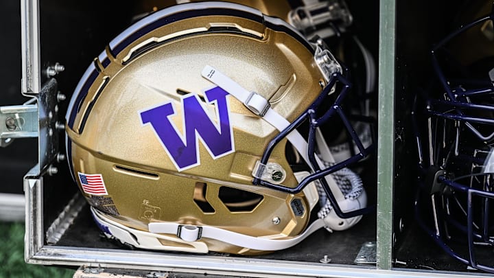 Oct 12, 2024; Iowa City, Iowa, USA;  A Washington Huskies helmet sits ready on the sidelines before the game against the Iowa Hawkeyes at Kinnick Stadium. Mandatory Credit: Jeffrey Becker-Imagn Images