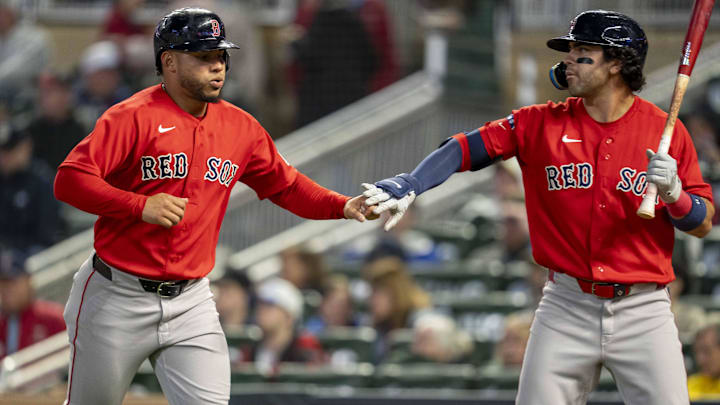 Apr 13, 2026; Minneapolis, Minnesota, USA; Boston Red Sox first baseman Willson Contreras (40) shakes hands with second baseman Marcelo Mayer (11) after scoring a run against the Minnesota Twins in the sixth inning at Target Field. Mandatory Credit: Jesse Johnson-Imagn Images