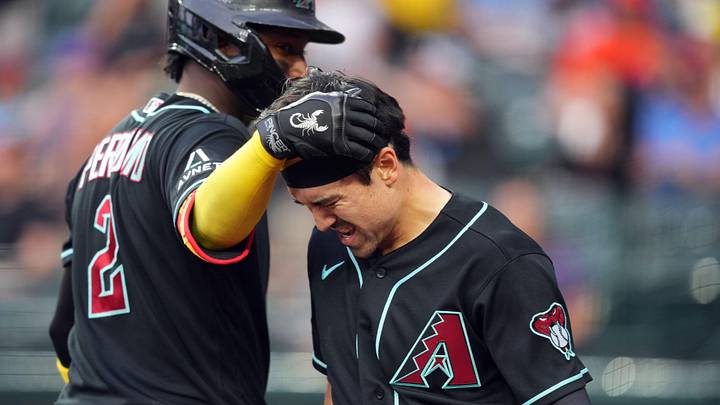 May 19, 2026; Phoenix, Arizona, USA; Arizona Diamondbacks right fielder Corbin Carroll (7) reacts with Arizona Diamondbacks shortstop Geraldo Perdomo (2) after getting hit a with a throw after sliding into third base with a triple against the San Francisco Giants and scoring a run on a throwing error during the first inning at Chase Field. Mandatory Credit: Joe Camporeale-Imagn Images May 19, 2026; Phoenix, Arizona, USA; Arizona Diamondbacks right fielder Corbin Carroll (7) reacts with Arizona Diamondbacks shortstop Geraldo Perdomo (2) after getting hit a with a throw after sliding into third base with a triple against the San Francisco Giants and scoring a run on a throwing error during the first inning at Chase Field. Mandatory Credit: Joe Camporeale-Imagn Images