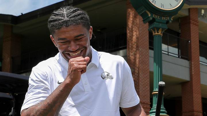 Cleveland Browns rookie wide receiver KC Concepcion breaks out into laughter as he waits to tee off on No. 1 during the Cleveland Browns Foundation Golf Tournament at Firestone Country Club, June 1, 2026, in Akron, Ohio.