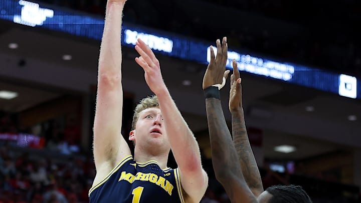 Feb 16, 2025; Columbus, Ohio, USA;  Michigan Wolverines center Danny Wolf (1) shoots the ball over Ohio State Buckeyes forward Aaron Bradshaw (4) during the first half at Value City Arena. Mandatory Credit: Joseph Maiorana-Imagn Images