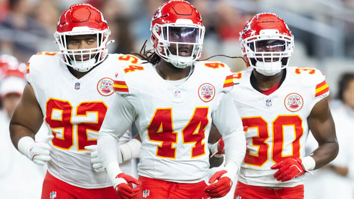  Kansas City Chiefs linebacker Cam Jones (44) with defensive tackle Marlon Tuipulotu (92) and running back Brashard Smith (30) against the Arizona Cardinals during a preseason NFL game at State Farm Stadium.
