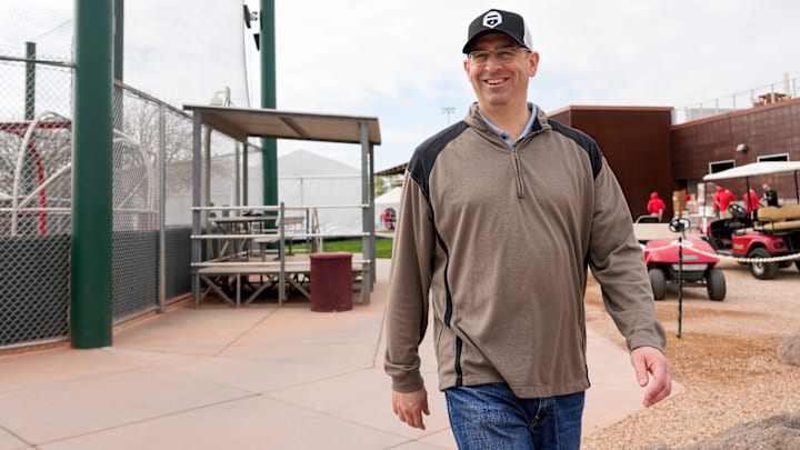 Reds president of baseball operations Nick Krall walks between fields at the Cincinnati Reds Player Development Complex in Goodyear, Ariz., on Wednesday, Feb. 12, 2025.