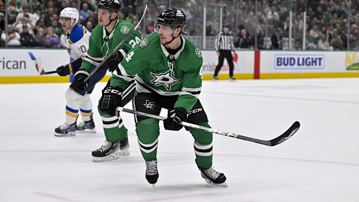 Dec 14, 2024; Dallas, Texas, USA; Dallas Stars center Roope Hintz (24) and defenseman Miro Heiskanen (4) in action during the game between the Dallas Stars and the St. Louis Blues at American Airlines Center. Mandatory Credit: Jerome Miron-Imagn Images