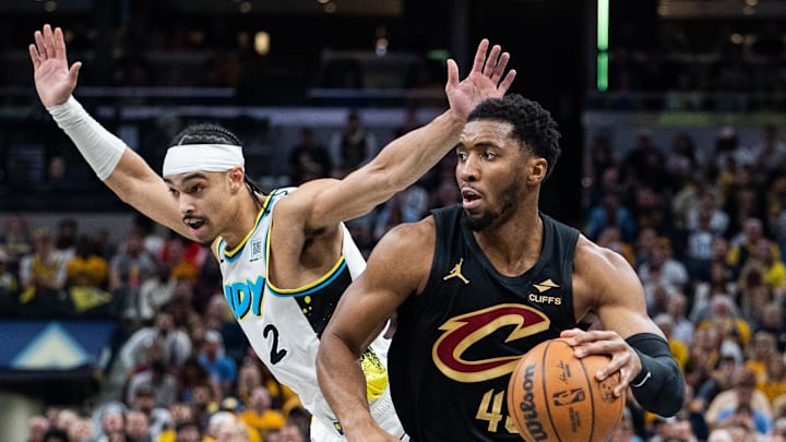 May 11, 2025; Indianapolis, Indiana, USA; Cleveland Cavaliers guard Donovan Mitchell (45) dribbles the ball while Indiana Pacers guard Andrew Nembhard (2) defends during game four of the second round for the 2025 NBA Playoffs at Gainbridge Fieldhouse. Mandatory Credit: Trevor Ruszkowski-Imagn Images
