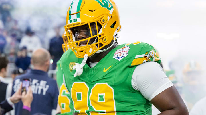 Jan 1, 2024; Glendale, AZ, USA; Oregon Ducks defensive lineman Terrance Green (99) against the Liberty Flames during the 2024 Fiesta Bowl at State Farm Stadium. Mandatory Credit: Mark J. Rebilas-USA TODAY Sports