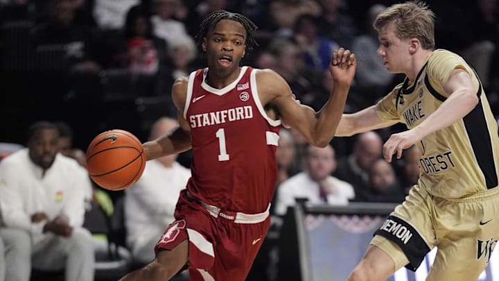 Feb 14, 2026; Winston-Salem, North Carolina, USA; Stanford Cardinal guard Ebuka Okorie (1) goes to the basket against Wake Forest Demon Deacons guard Isaac Carr (7) during the second half at Lawrence Joel Veterans Memorial Coliseum. Mandatory Credit: Jim Dedmon-Imagn Images