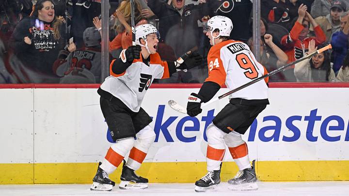 Oct 17, 2026; Philadelphia, Pennsylvania, USA; Philadelphia Flyers left wing Porter Martone (94) celebrates his goal with right wing Matvei Michkov (39) against the Ottawa Senators during the second period at Xfinity Mobile Arena. Mandatory Credit: Eric Hartline-Imagn Images