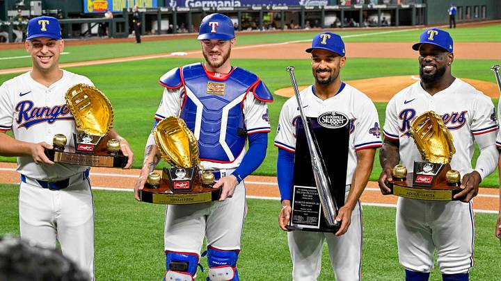 Apr 10, 2024; Arlington, Texas, USA; (from left) Texas Rangers first baseman Nathaniel Lowe (30) and catcher Jonah Heim (28) and second baseman Marcus Semien (2) and right fielder Adolis Garcia (53) and shortstop Corey Seager (5) pose with their Gold Glove and Silver Slugger awards before the game between the Texas Rangers and the Oakland Athletics at Globe Life Field. Mandatory Credit: Jerome Miron-USA TODAY Sports Apr 10, 2024; Arlington, Texas, USA; (from left) Texas Rangers first baseman Nathaniel Lowe (30) and catcher Jonah Heim (28) and second baseman Marcus Semien (2) and right fielder Adolis Garcia (53) and shortstop Corey Seager (5) pose with their Gold Glove and Silver Slugger awards before the game between the Texas Rangers and the Oakland Athletics at Globe Life Field. Mandatory Credit: Jerome Miron-USA TODAY Sports