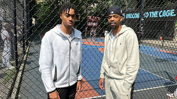 Reese Alston, left, has a UW basketball offer. He's shown with his father Rafer at the NYC outdoor courts. 