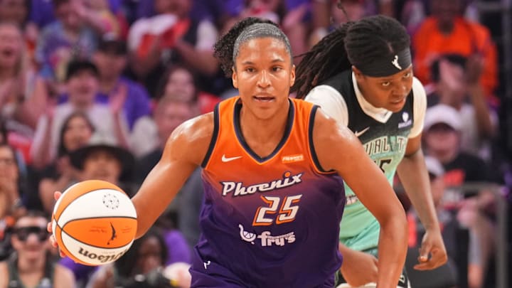 Sep 19, 2025; Phoenix, Arizona, USA; Phoenix Mercury forward Alyssa Thomas (25) dribbles against the New York Liberty during the first half of game three of round one for the 2025 WNBA Playoffs at PHX Arena. Mandatory Credit: Joe Camporeale-Imagn Images