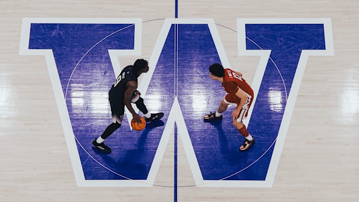 Zoom Diallo dribbles over the W in Alaska Airlines Arena last season.