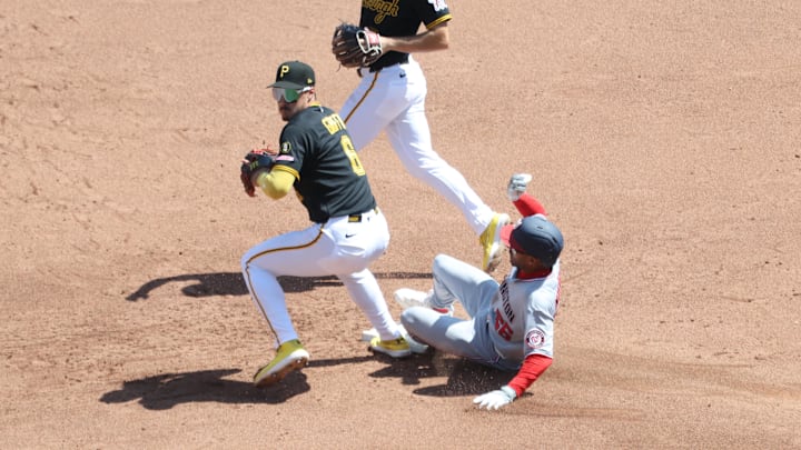 Apr 16, 2026; Pittsburgh, Pennsylvania, USA;  Washington Nationals second baseman Nasim Nuñez (26) slides into Pittsburgh Pirates shortstop Konnor Griffin (6) at second base forcing an error and allowing two runs to score during the fifth inning at PNC Park. Mandatory Credit: Charles LeClaire-Imagn Images