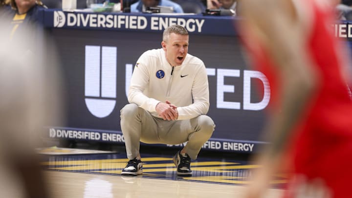Feb 18, 2026; Morgantown, West Virginia, USA; West Virginia Mountaineers head coach Ross Hodge yells from the sideline during the first half against the Utah Utes at Hope Coliseum. 
