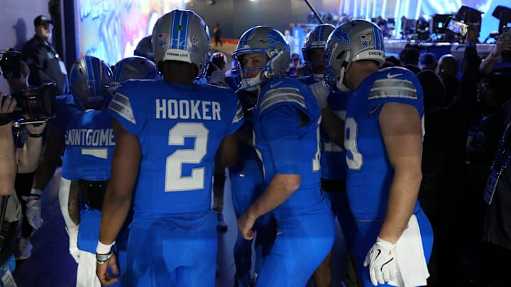 Detroit Lions quarterback Jared Goff (16) huddles with teammates in the tunnel before the NFC divisional round between the Detroit Lions and the Washington Commanders at Ford Field in Detroit on Saturday, Jan. 18, 2025.