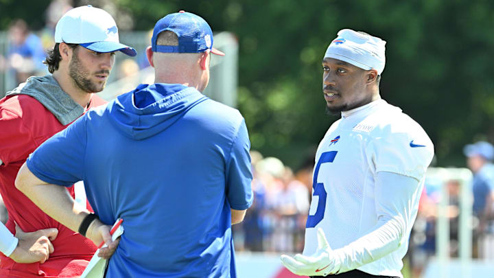 Buffalo Bills wide receiver Joshua Palmer talks with quarterback Josh Allen and offensive coordinator Joe Brady.