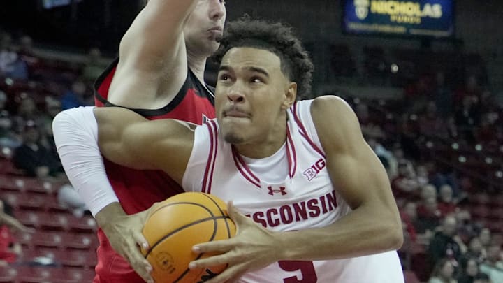 Wisconsin guard John Tonje (9) drives past UW-River Falls guard Dylan Parker (12) during the second half of their preseason game Wednesday, October 30, 2024 at the Kohl Center in Madison, Wisconsin. Wisconsin beat UW-River Falls 78-62. Wisconsin guard John Tonje (9) drives past UW-River Falls guard Dylan Parker (12) during the second half of their preseason game Wednesday, October 30, 2024 at the Kohl Center in Madison, Wisconsin. Wisconsin beat UW-River Falls 78-62.