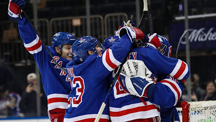 Feb 2, 2025; New York, New York, USA; New York Rangers goalie Jonathan Quick (32) celebrates his 400th career win after a 4-2 victory against the Vegas Golden Knights at Madison Square Garden. Mandatory Credit: Danny Wild-Imagn Images