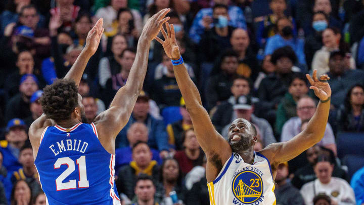 Mar 24, 2023; San Francisco, California, USA;  Philadelphia 76ers center Joel Embiid (21) shoots the basketball over Golden State Warriors forward Draymond Green (23) during the fourth quarter at Chase Center. Mandatory Credit: Neville E. Guard-USA TODAY Sports