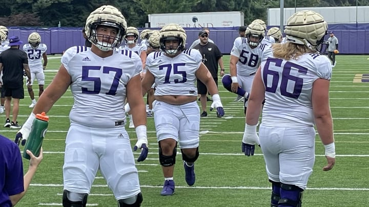 Newcomers Enokk Vimahi (57) and D'Angalo Titialii (75) and Landen Hatchett (66) got through stretching exercises.