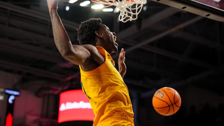 Feb 5, 2026; Cincinnati, Ohio, USA;  West Virginia Mountaineers forward Brenen Lorient (0) dunks the ball against the Cincinnati Bearcats in the second half at Fifth Third Arena. Mandatory Credit: Aaron Doster-Imagn Images