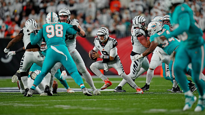 Cincinnati Bengals quarterback Joe Burrow (9) cuts right as he keeps the ball on a play in the second quarter of the NFL Week 4 game between the Cincinnati Bengals and the Miami Dolphins at PayCor Stadium in downtown on Thursday, Sept. 29, 2022. The Bengals 14-12 at halftime.