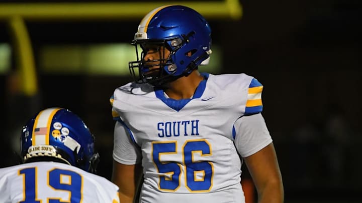 Olathe South four-star prospect Juju Marks has flipped his commitment from Kansas to Nebraska.