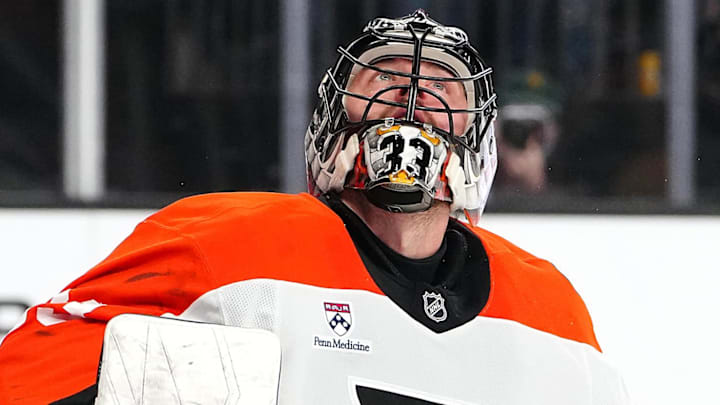 Jan 19, 2026; Las Vegas, Nevada, USA; Philadelphia Flyers goaltender Samuel Ersson (33) watches the puck after deflecting a Vegas Golden Knights shot during the first period at T-Mobile Arena. 