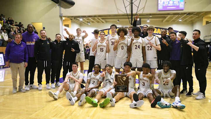 Riordan holds up the school's first Northern California championship trophy since 2022 following a 52-40 home win over De L Salle in the Open Division Tuesday.  