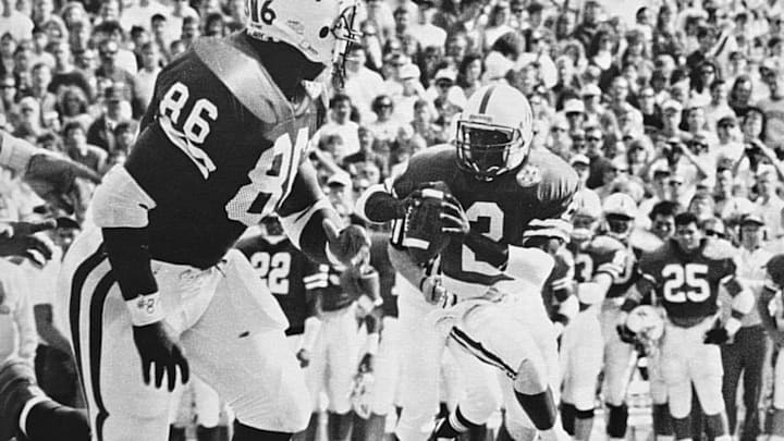 Johnny Mitchell breaks into the open before receiving a touchdown pass from Mickey Joseph.