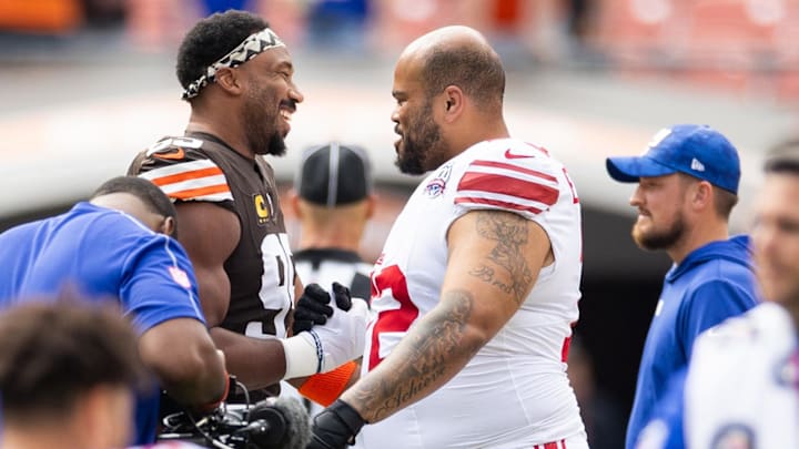 Sep 22, 2024; Cleveland, Ohio, USA; Cleveland Browns defensive end Myles Garrett (95) greets New York Giants guard Jermaine Eluemunor (72) during warm ups before the game at Huntington Bank Field. Mandatory Credit: Scott Galvin-Imagn Images