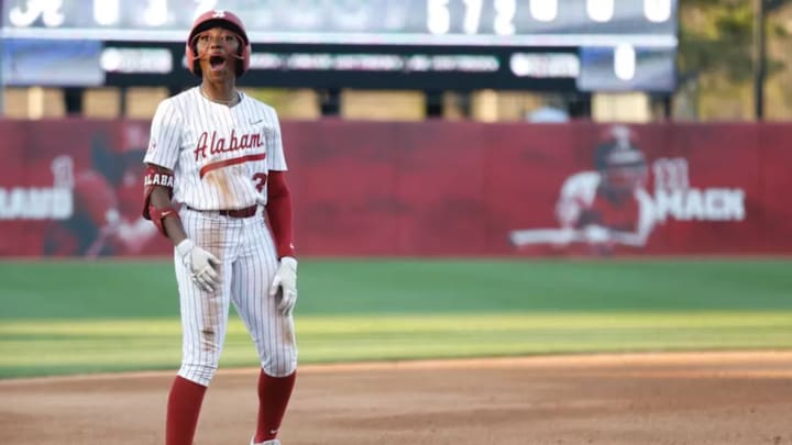 Alabama's Kristen White celebrates on third base during the Crimson Tide's game with UAB at the Crimson Classic on Friday at Rhoads Stadium. 