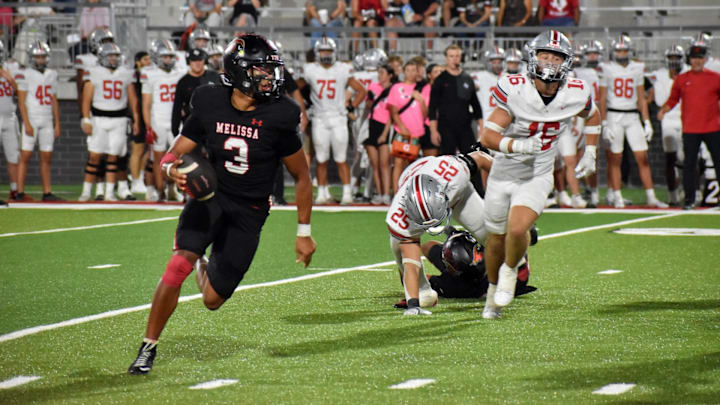Melissa quarterback Brett Holloway runs toward the end zone in the third quarter of a game Friday against Lucas Lovejoy at Coach Kenny Deel Stadium.