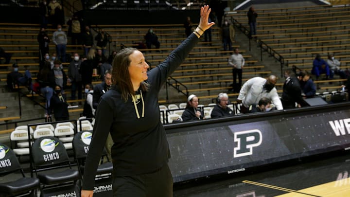 Purdue head coach Katie Gearlds waves at the fans