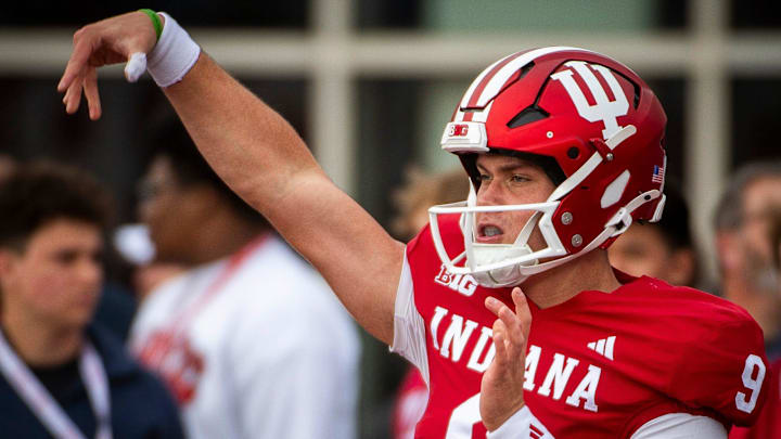 Indiana quarterback Kurtis Rourke (9) warms up before the Michigan game at Memorial Stadium.