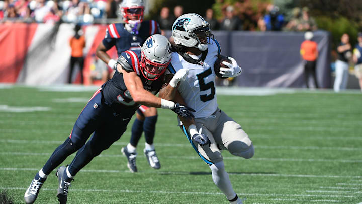 Sep 28, 2025; Foxborough, Massachusetts, USA; New England Patriots linebacker Elijah Ponder (91) knocks Carolina Panthers running back Rico Dowdle (5) out of bounds during the first half at Gillette Stadium. 