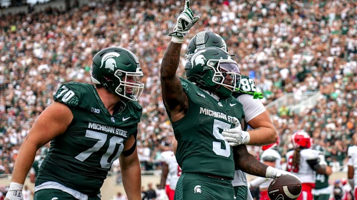 Michigan State's Makhi Frazier, center, celebrates his touchdown against Youngstown State during the second quarter on Saturday, Sept. 13, 2025, at Spartan Stadium in East Lansing.
