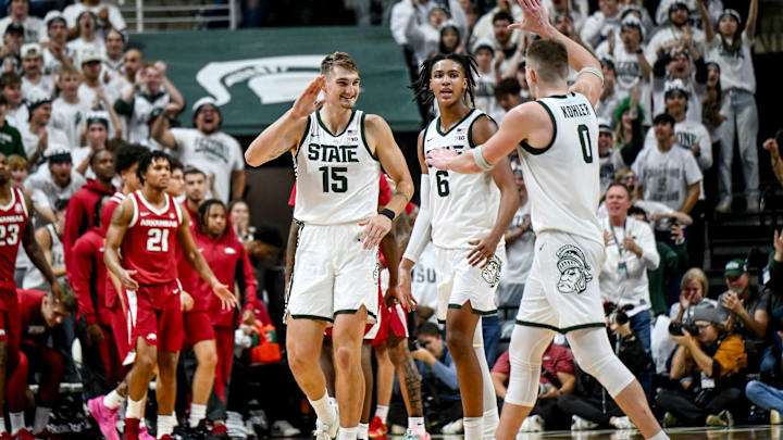 Michigan State's Carson Cooper, left, celebrates with Jaxon Kohler, right, after a score against Arkansas during the second half on Saturday, Nov. 8, 2025, at the Breslin Center in East Lansing. Michigan State's Carson Cooper, left, celebrates with Jaxon Kohler, right, after a score against Arkansas during the second half on Saturday, Nov. 8, 2025, at the Breslin Center in East Lansing.