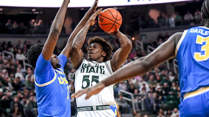 Michigan State's Coen Carr, right, shoots UCLA's Xavier Booker defends during the first half on Tuesday, Feb. 17, 2026, at the Breslin Center in East Lansing.