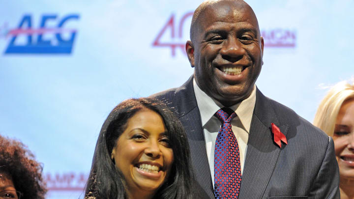 Magic Johnson (right) and his wife Cookie Johnson (left) during the press conference held by the Magic Johnson foundation at the Staples Center.