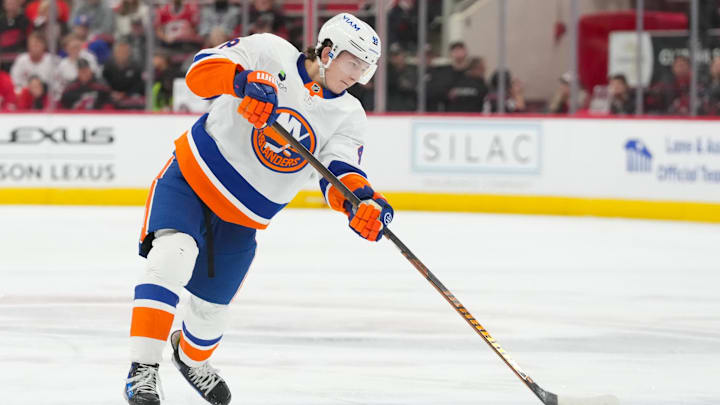 Oct 30, 2025; Raleigh, North Carolina, USA;  New York Islanders defenseman Matthew Schaefer (48) takes a shot against the Carolina Hurricanes during the second period at Lenovo Center. Mandatory Credit: James Guillory-Imagn Images