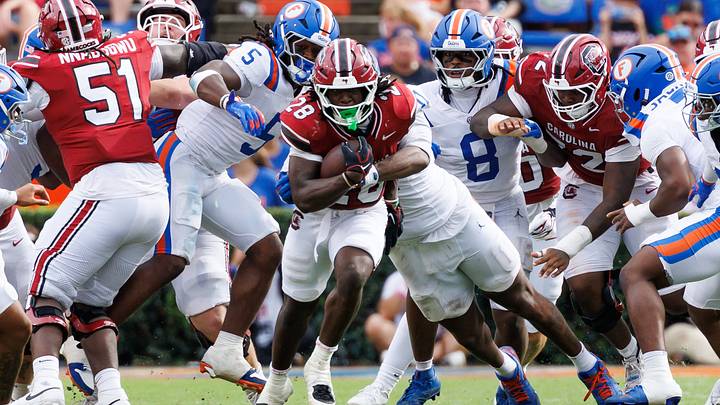 Oct 10, 2026; Gainesville, Florida, USA; South Carolina Gamecocks running back Matt Fuller (28) rushes with the ball while Florida Gators jack Jayden Woods (0) tackles during the second half at Ben Hill Griffin Stadium. Mandatory Credit: Matt Pendleton-Imagn Images Oct 10, 2026; Gainesville, Florida, USA; South Carolina Gamecocks running back Matt Fuller (28) rushes with the ball while Florida Gators jack Jayden Woods (0) tackles during the second half at Ben Hill Griffin Stadium. Mandatory Credit: Matt Pendleton-Imagn Images