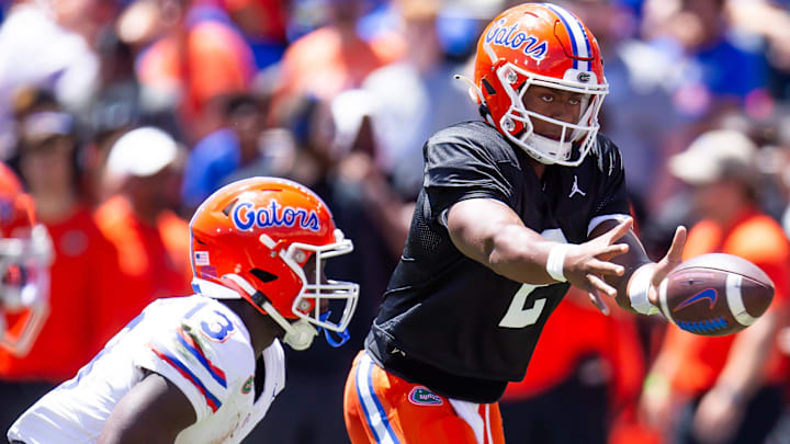 Florida Gators quarterback DJ Lagway (2) pitches the ball to Florida Gators running back Jadan Baugh (13) in the first half during the Orange and Blue game at Ben Hill Griffin Stadium in Gainesville, FL on Saturday, April 13, 2024 [Doug Engle/Gainesville Sun]2024