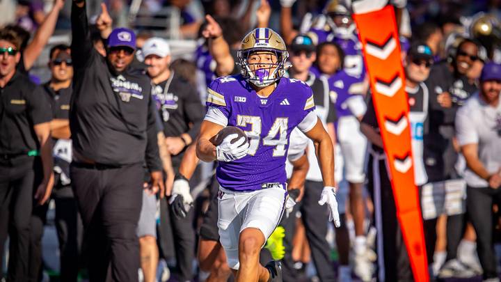 Brian Bonner Jr. gets loose on a 55-yard run for the Huskies. Brian Bonner Jr. gets loose on a 55-yard run for the Huskies.